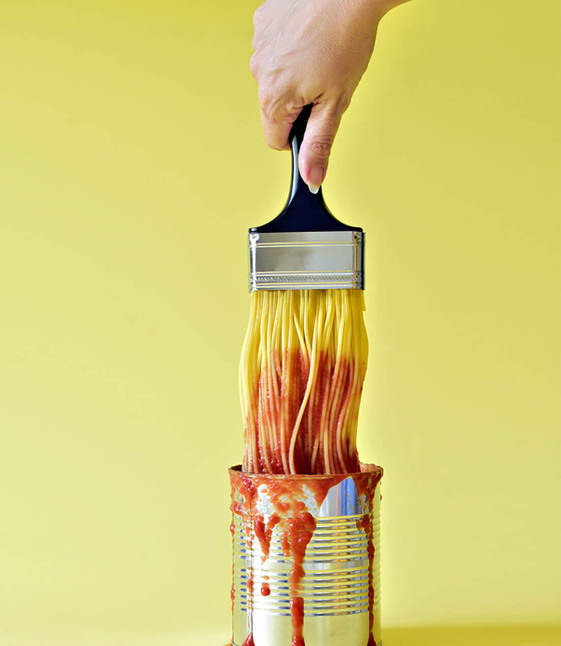 Multichannel Spaghetti attached to a paintbrush dipped in a can of secret digital ingredients the best tomato sauce to success 
